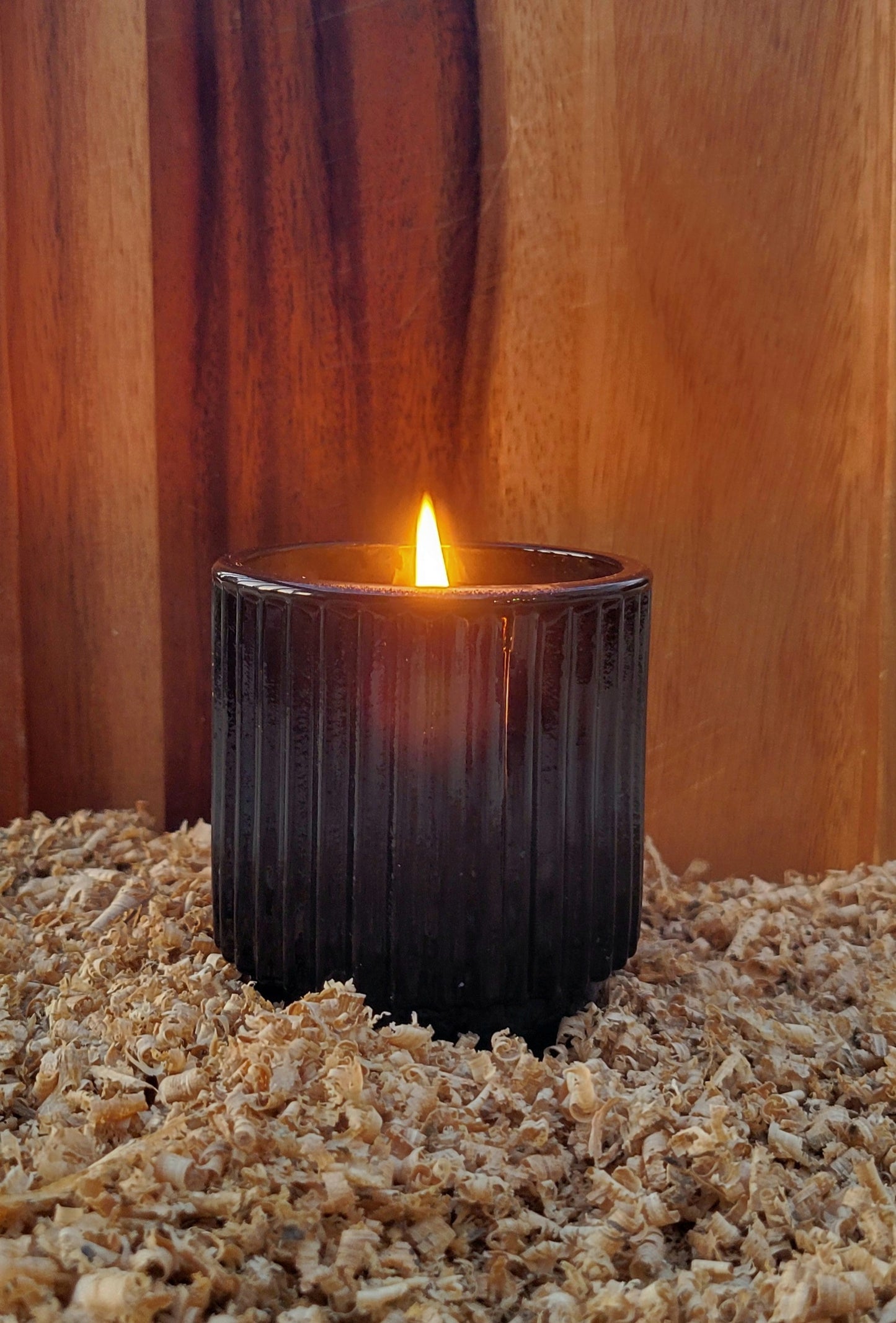 black opaque jar withh a 7oz beeswax candle, non-toxic, scented with pure essential oils